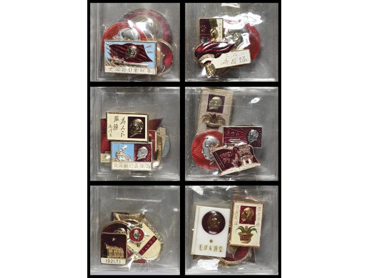 Housed in a plastic sleeve binder, the collection includes enamel pins depicting Mao’s portrait, revolutionary slogans, flags