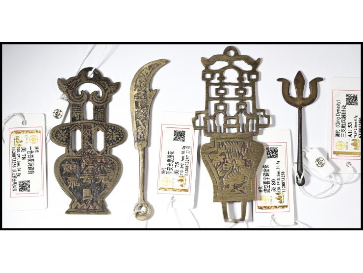 including a trident weapon charm, an openwork “Double Happiness” copper pendant, a “Peace and Auspicious Celebration” charm, 