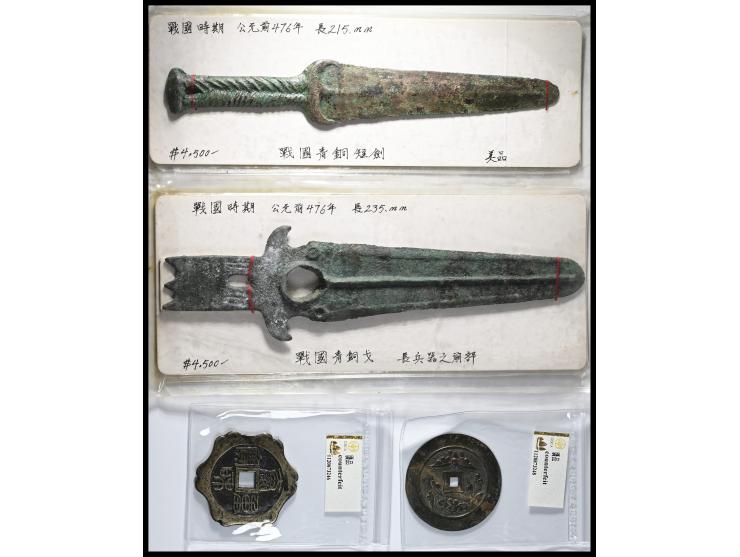 comprising two bronze swords including one socket-hilted example and one long-tanged socket-hilted sword, accompanied by five